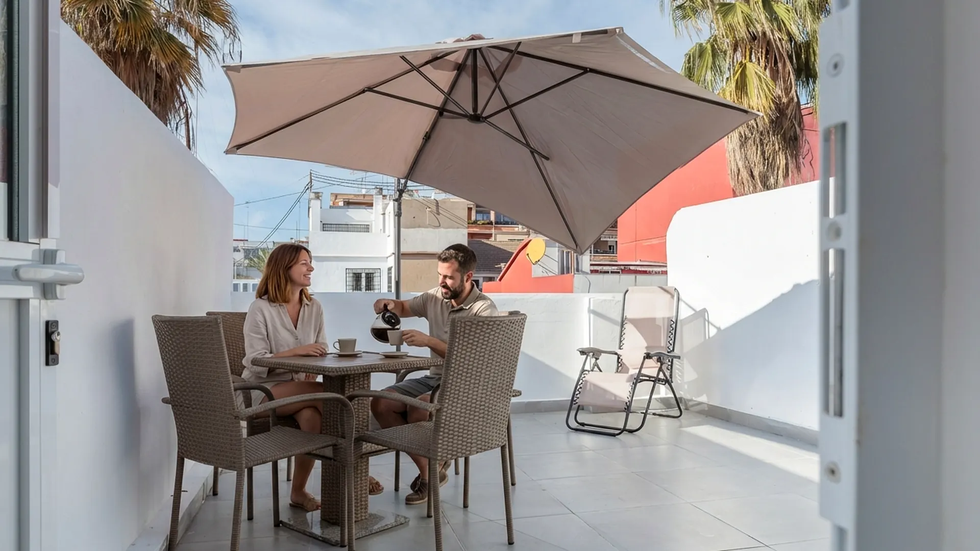 Couple having coffee on the SleekLofts private terrace in Valencia