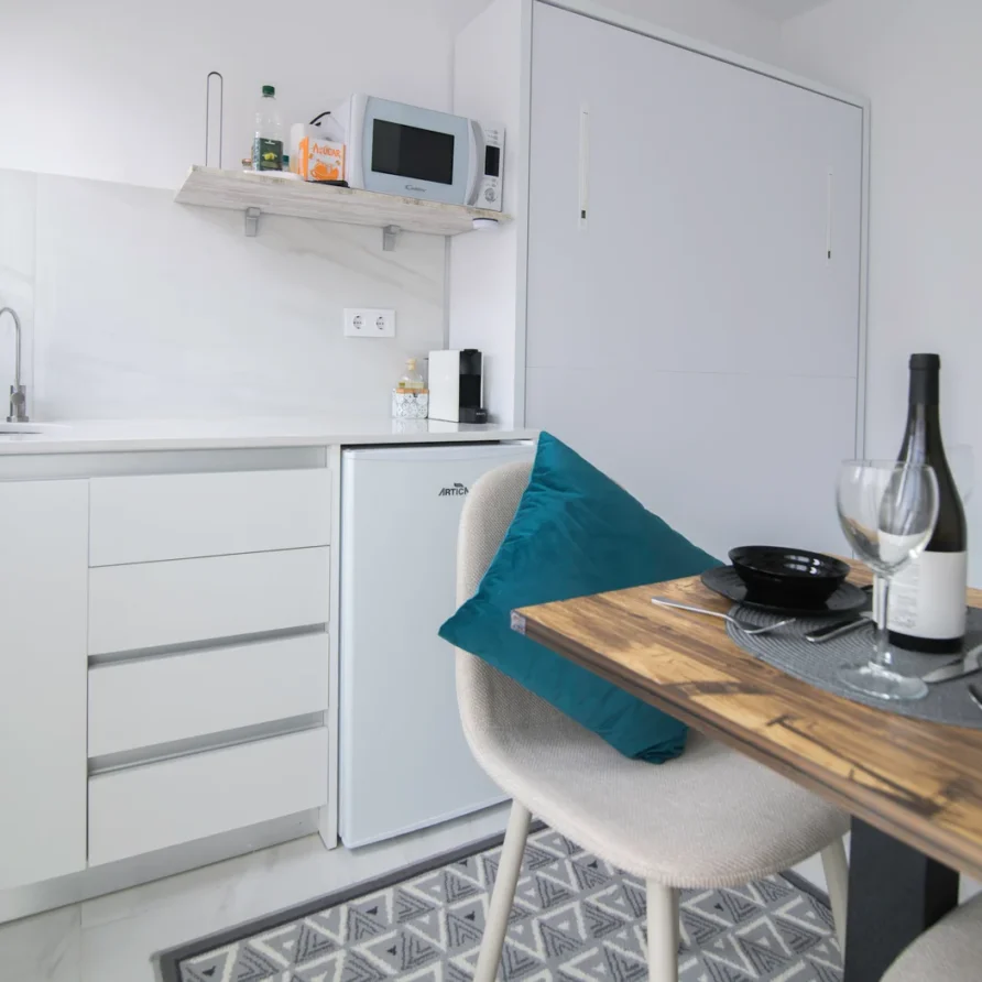 Cozy studio apartment kitchen with dining area