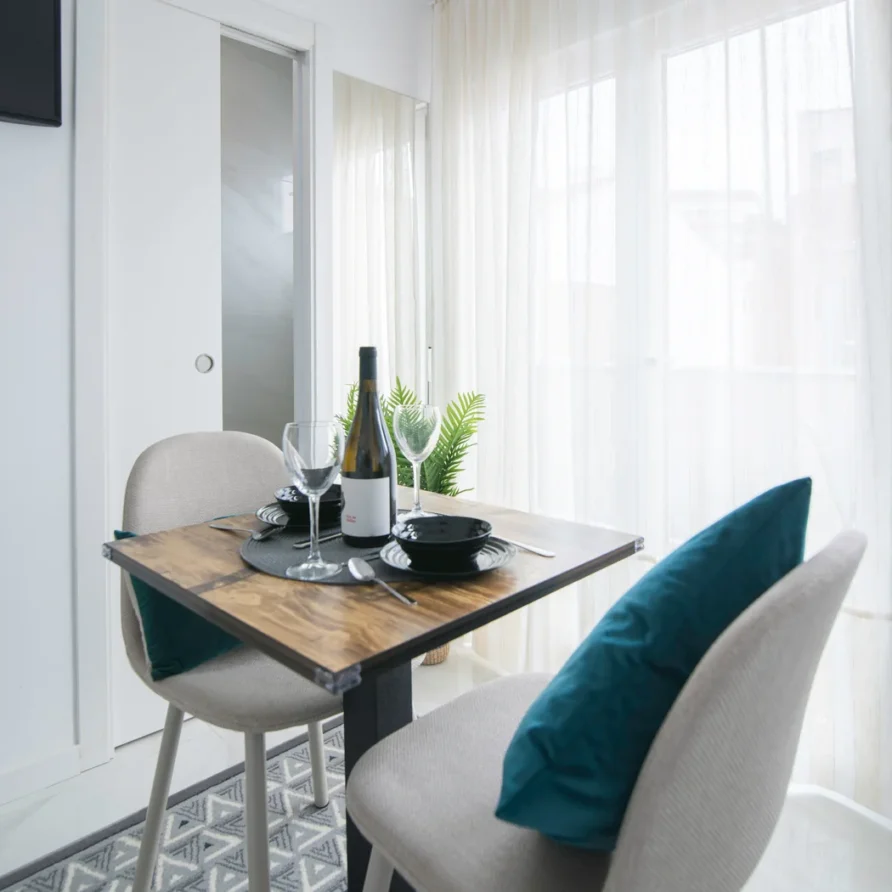 Dining for two by a bright window