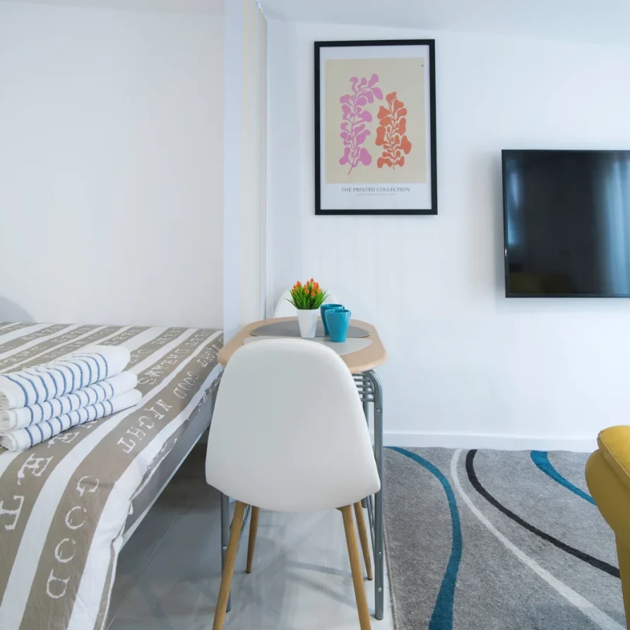 Modern small room with bed and table