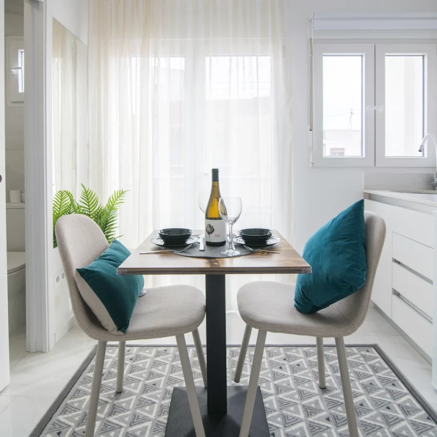 Dining table for two in modern white kitchen