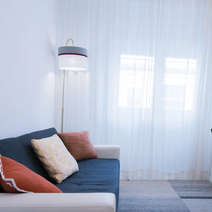 A living room with a blue sofa