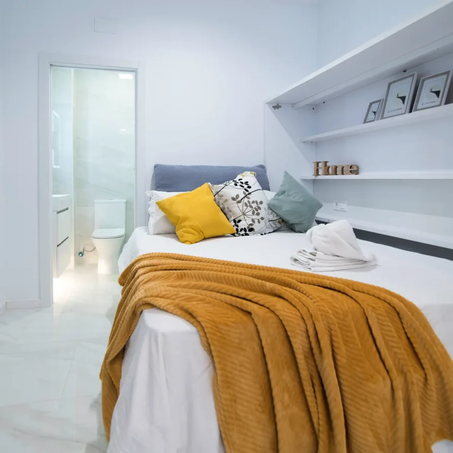 Cozy bedroom with white linens & decor