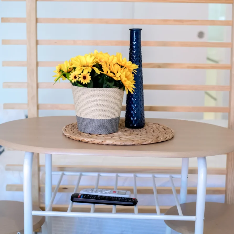 Small round table with a woven placemat