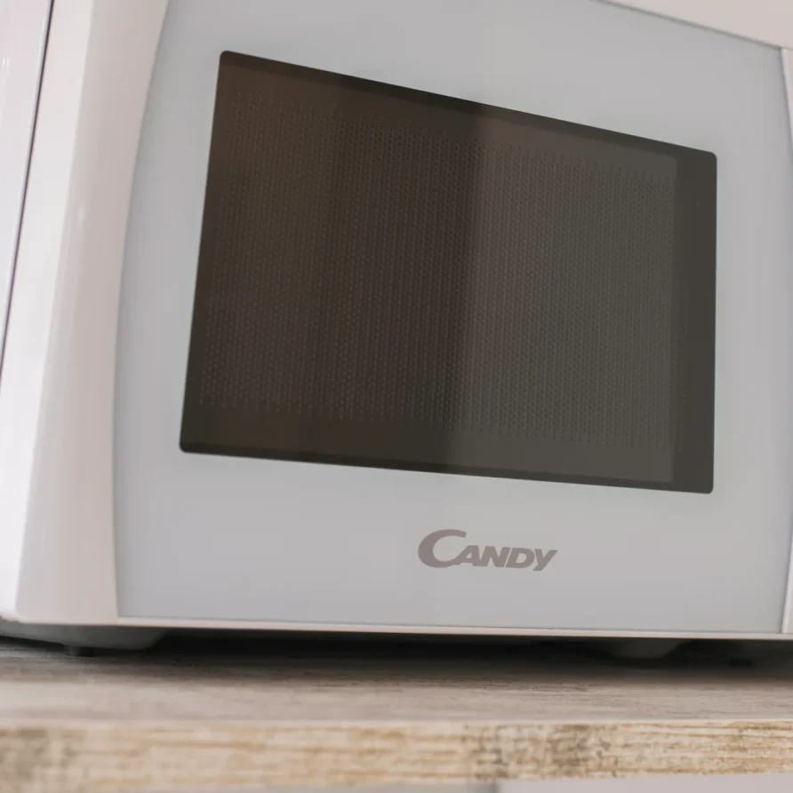 White Candy microwave oven on a counter