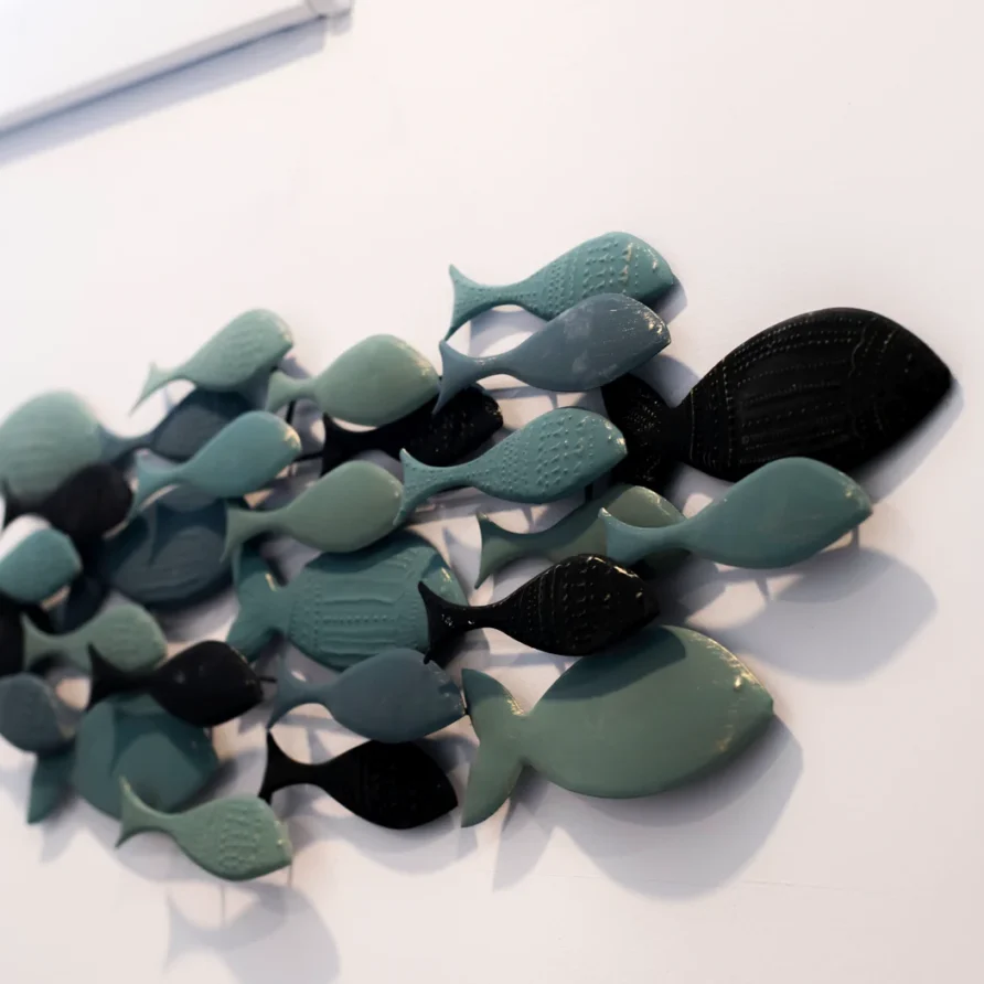 Ceramic teal & black fish wall art