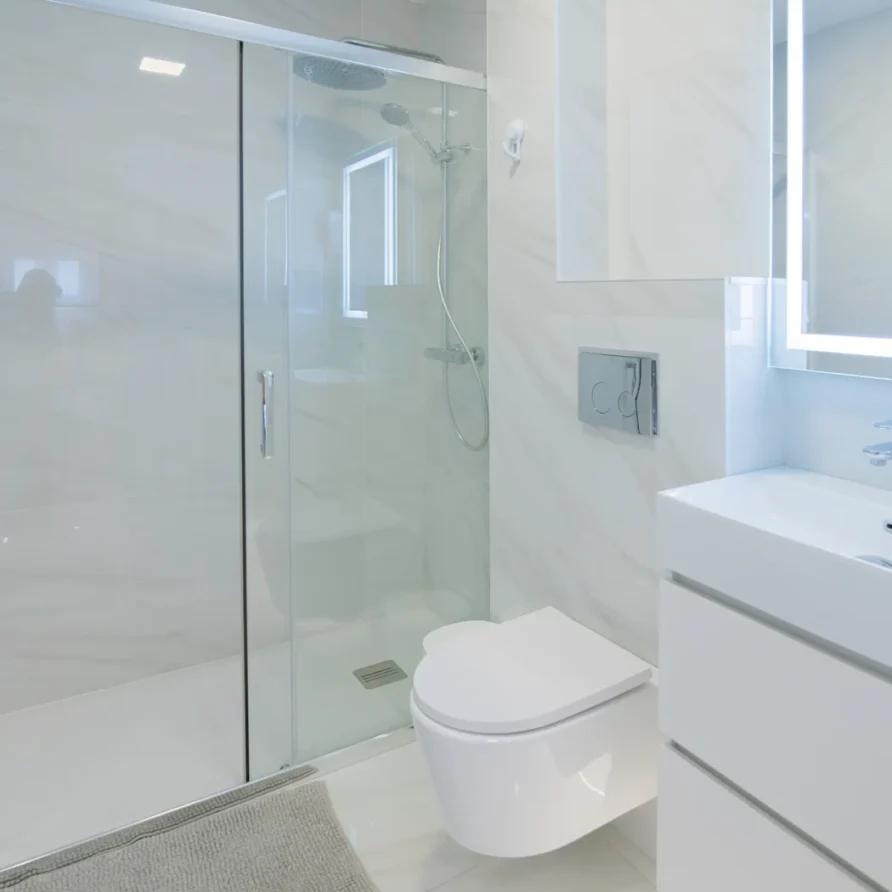 Modern bathroom with white walls and fixtures