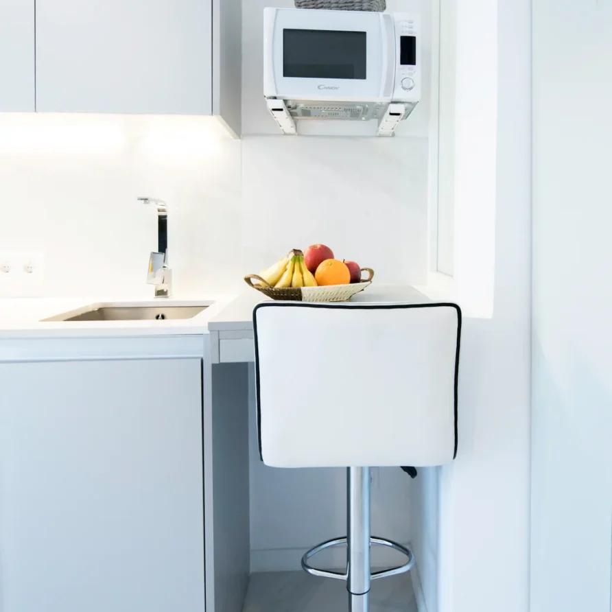 Modern white kitchen with countertop and appliances