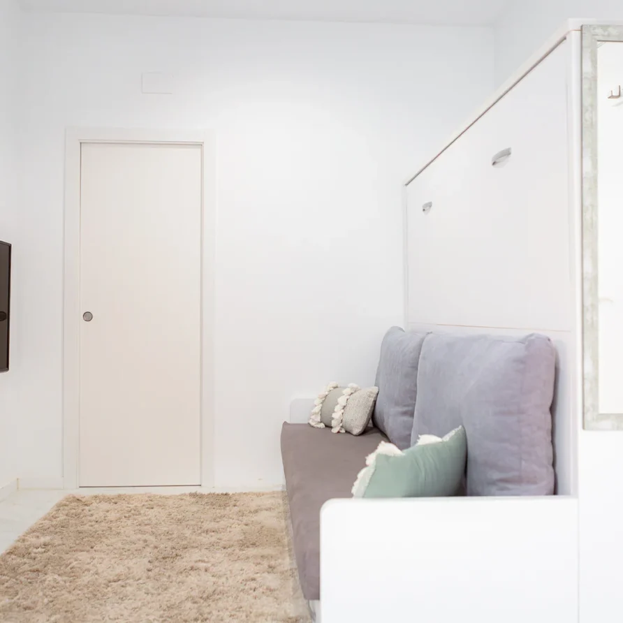 White room with a sofa
