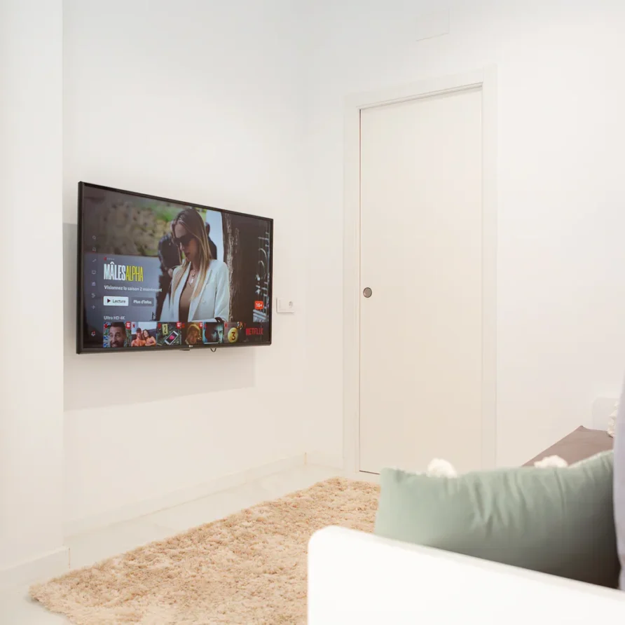 Minimal living room with wall TV