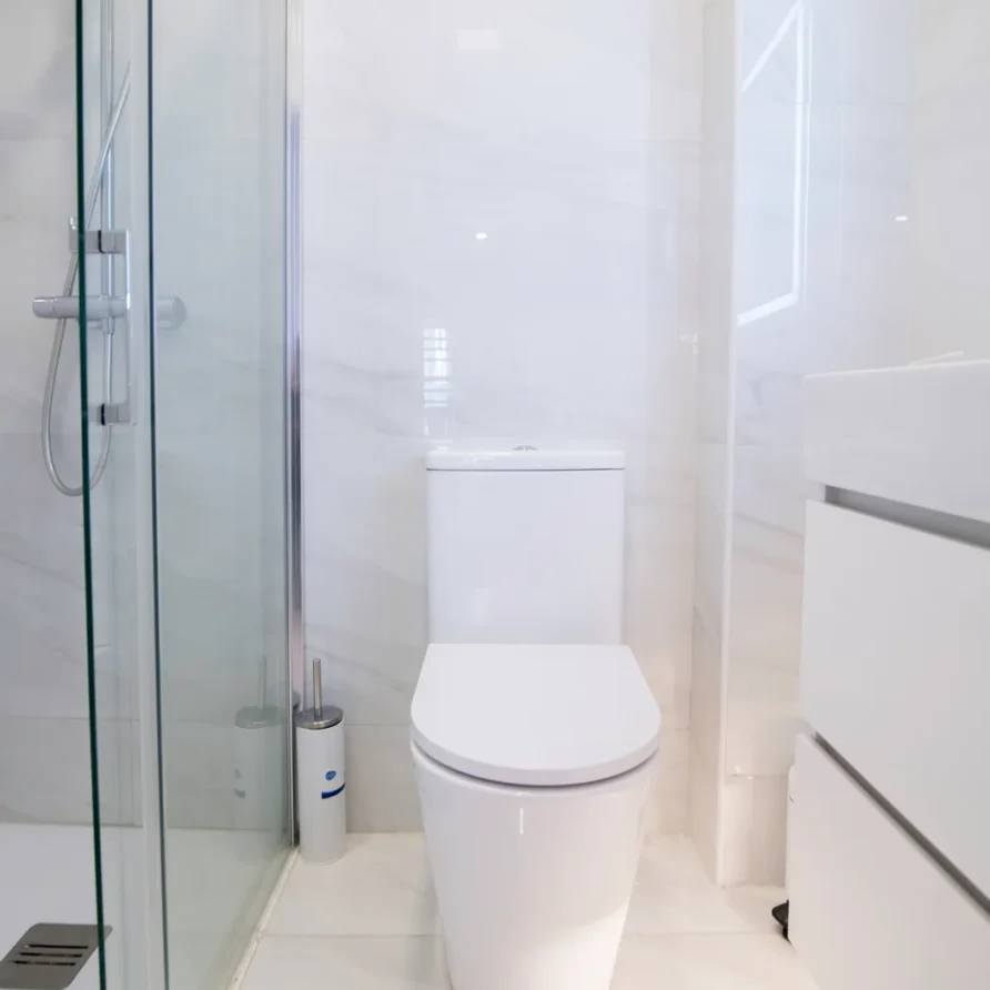 Modern white bathroom with shower and vanity