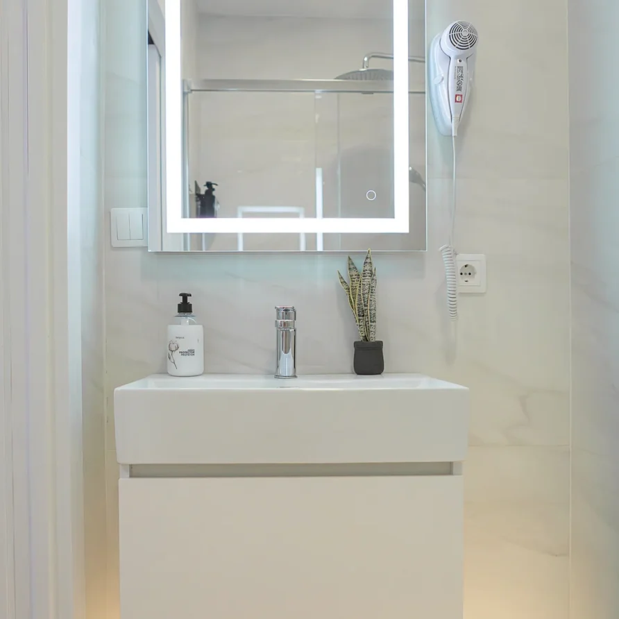 Modern bathroom vanity with lighted mirror